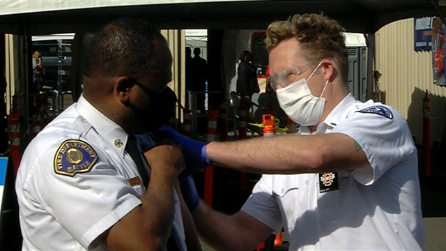 Seattle Fire Chief Harold Scoggins receives COVID-19 vaccine